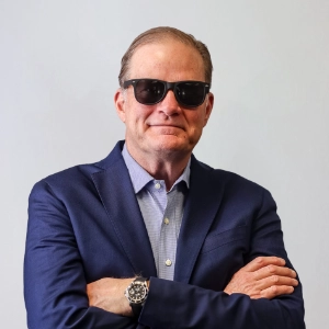 John Flinn, President of Sunline Global wearing sunglasses