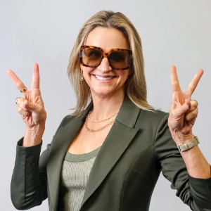 Paige Flinn, EVP of People at Sunline Global wearing sunglasses