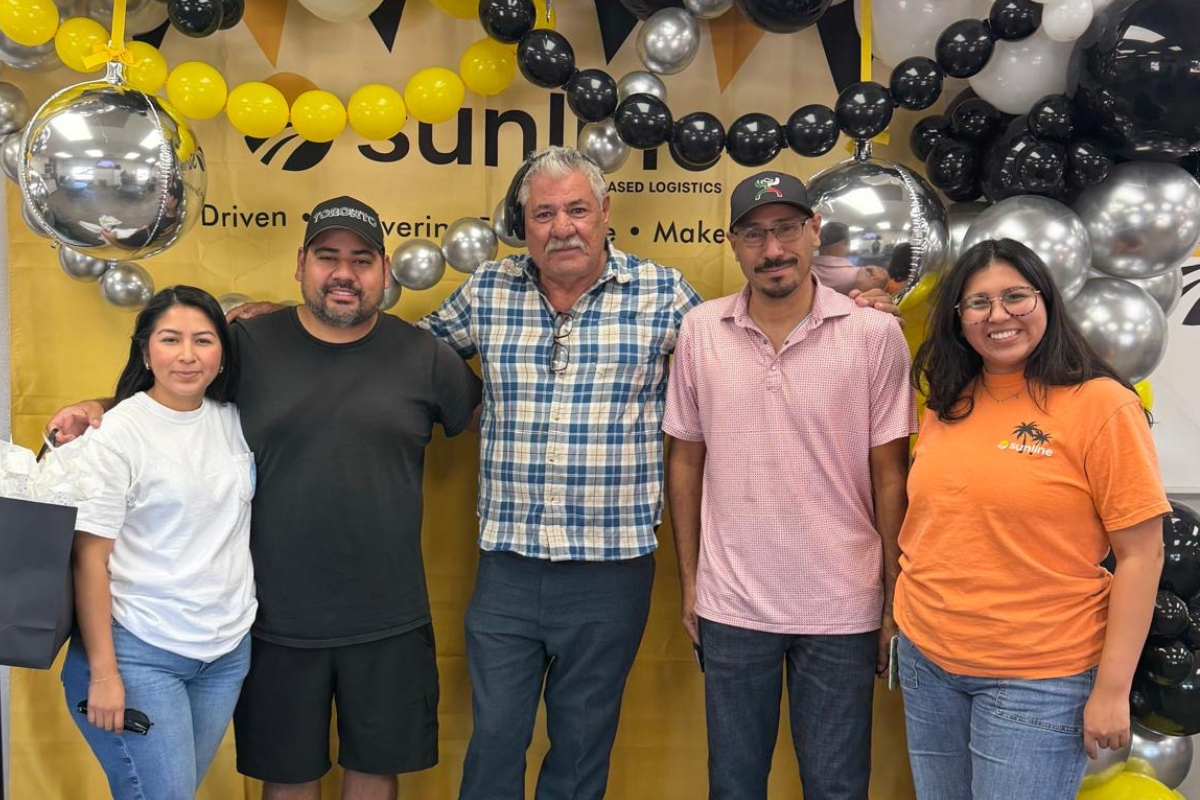 Three male drivers receiving their driver appreciation gifts from two Sunline